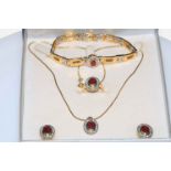 Ruby and diamond 18 carat gold suite of jewellery containing necklace with pendant, bracelet,