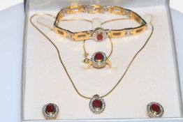 Ruby and diamond 18 carat gold suite of jewellery containing necklace with pendant, bracelet,