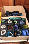 Two boxes of beadwork necklaces and bracelets.