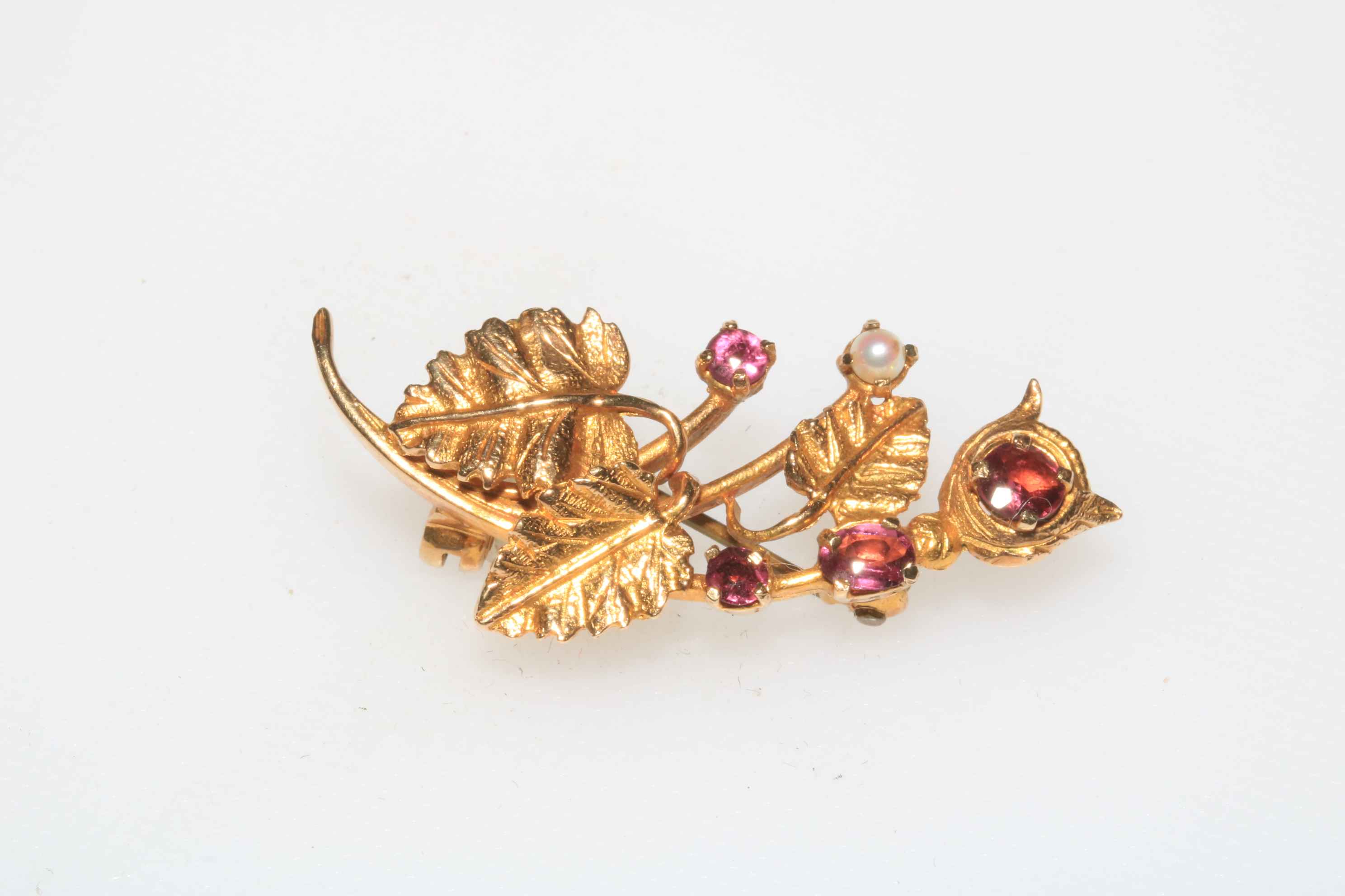 9 carat gold leaf design pearl and gem set brooch.