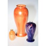 Orange glazed Ruskin vase and two Wilkinsons vases (3).