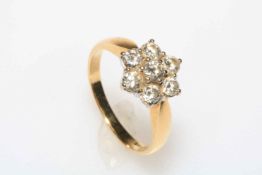 18 carat gold seven stone diamond petal design ring, size Q.