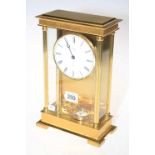 Rapport of London brass and glass mantel clock with enamel dial.
