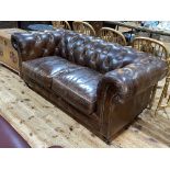 Artsome for Coach House tan buttoned leather two seater Chesterfield settee.