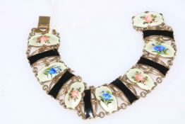 Norwegian silver bracelet with seven floral decorated enamel panels by Ivor T Holth.