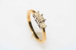 18 carat twelve stone diamond ring set in three stone design, size O.
