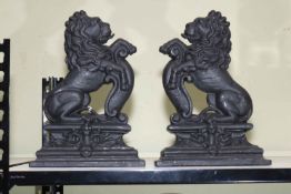 Pair of cast iron lion doorstop's, 36cm high.