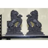 Pair of cast iron lion doorstop's, 36cm high.