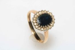 9 carat gold, oval sapphire and diamond dress ring, size Q.
