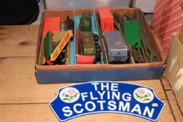 Collection of train carriages and track, together with cast iron The Flying Scotsman sign.