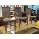 Set of three gold oak ecclesiastical panel back chairs (one arm and two single).