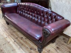 Victorian mahogany framed settee in deep buttoned ox blood leather.
