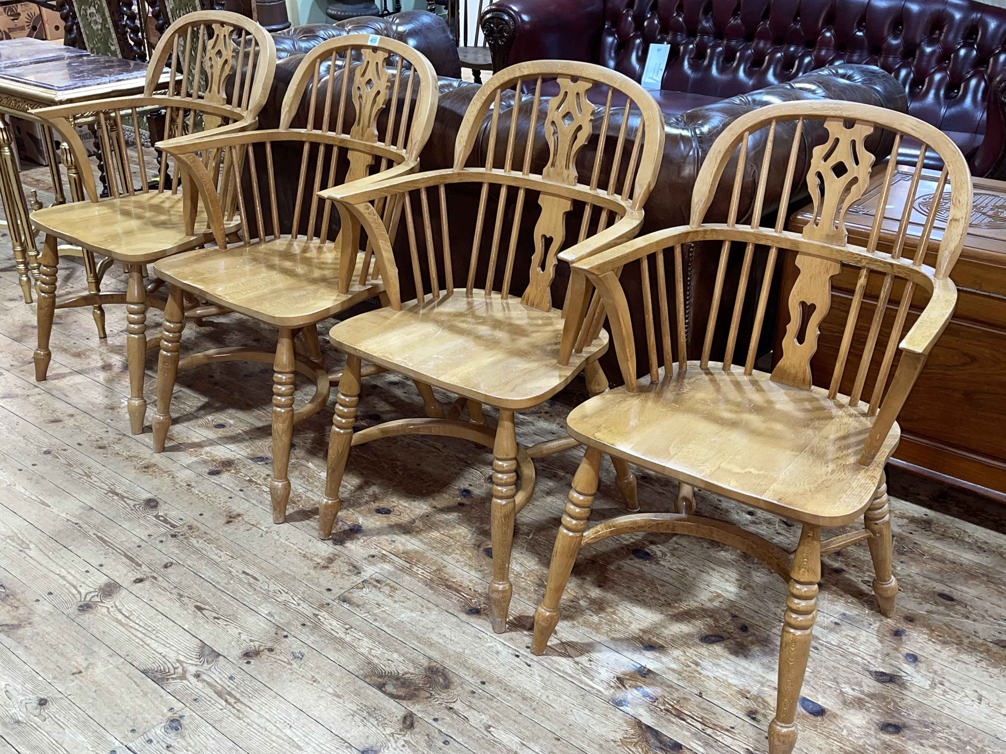 Set of four Windsor pierced splat back elbow chairs with crinoline stretchers.