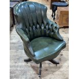Green deep buttoned and studded leather swivel office chair.