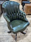 Green deep buttoned and studded leather swivel office chair.