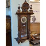 Victorian walnut Vienna style wall clock with enamelled and brass dial.