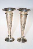 Pair of Edwardian heavily loaded silver vases with embossed decoration, London 1908.