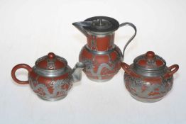 Chinese Yixing Earthen Ware tea set with silvered design overlay.