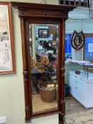 Victorian mahogany rectangular bevelled wall mirror with canopy top and turned columns,