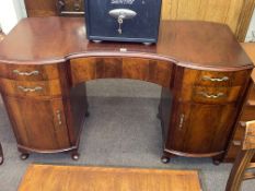 Mahogany inverted serpentine front dressing table, 75cm by 129cm by 57cm.