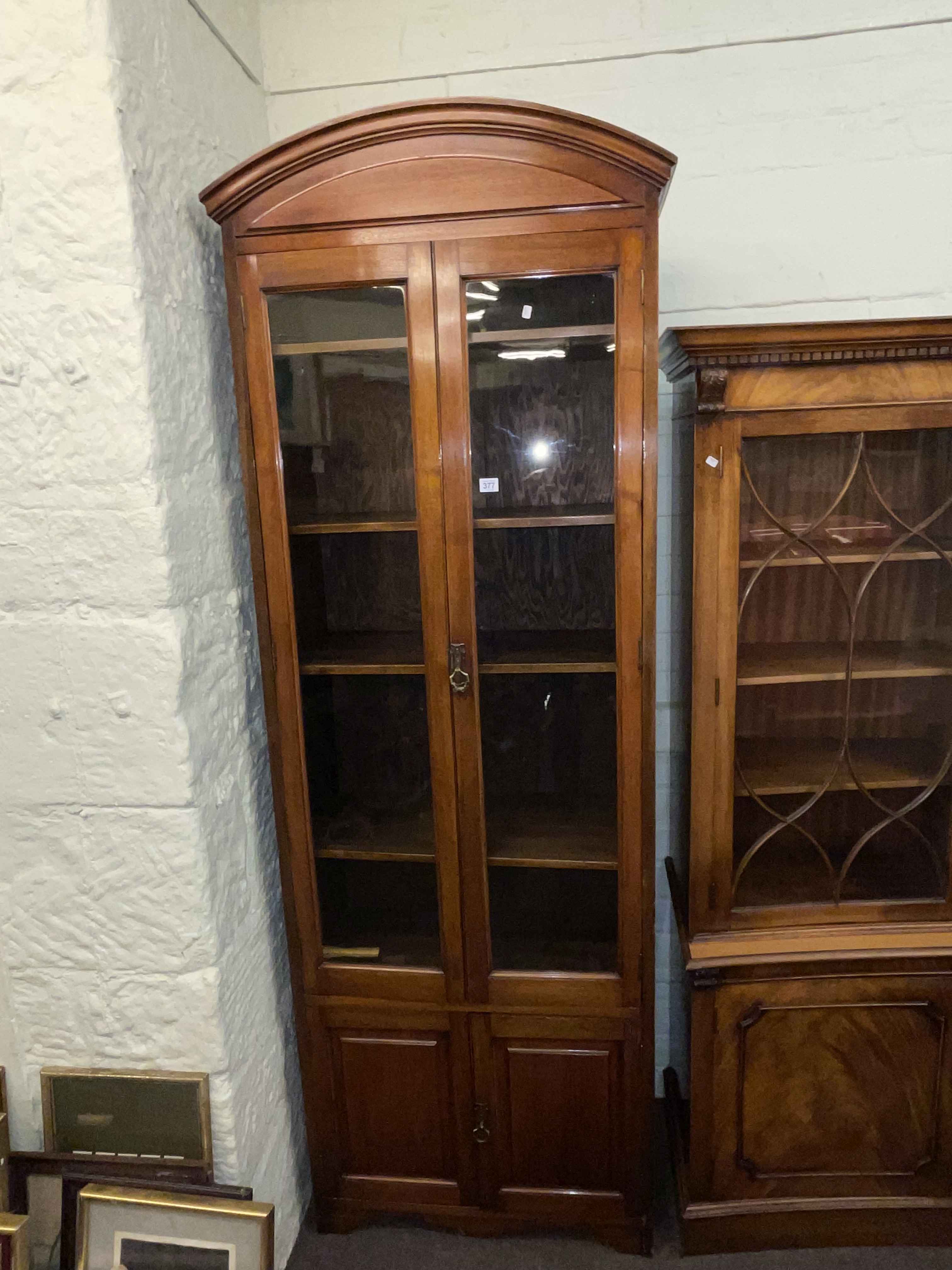Early 20th Century four door cabinet bookcase 217cm by 77cm by 38cm.