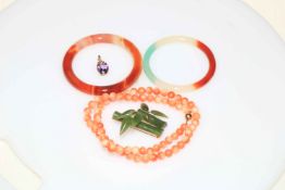 Coral necklace, bangles, brooch and 9 carat gold pendant.