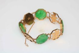 Chinese gold and green jade bracelet, the hexagonal jade panels having scroll chased borders.