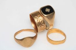 Three 9 carat gold rings and one 22 carat gold ring (4).