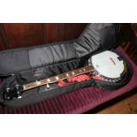 Remo Deville mother of pearl inlaid banjo with case.