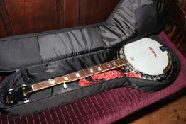 Remo Deville mother of pearl inlaid banjo with case.