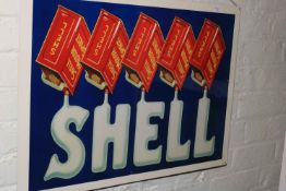 Tin sign marked Shell.