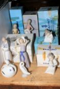 Eight Lladro and one Nao figurines including cherubs, geese, etc.
