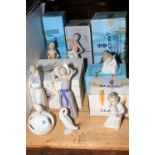 Eight Lladro and one Nao figurines including cherubs, geese, etc.