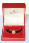 Omega ladies 9 carat gold wristwatch, with guarantee paper dated 1974, and box.