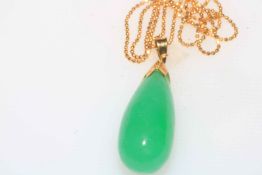 18 carat gold and green jade pendant.