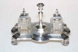 Victorian silver inkstand having engraved decoration and on scroll feet,