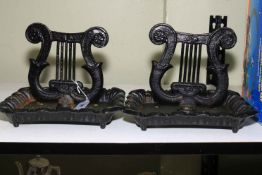 Pair of cast iron harp shaped boot scrapers, 26cm high.