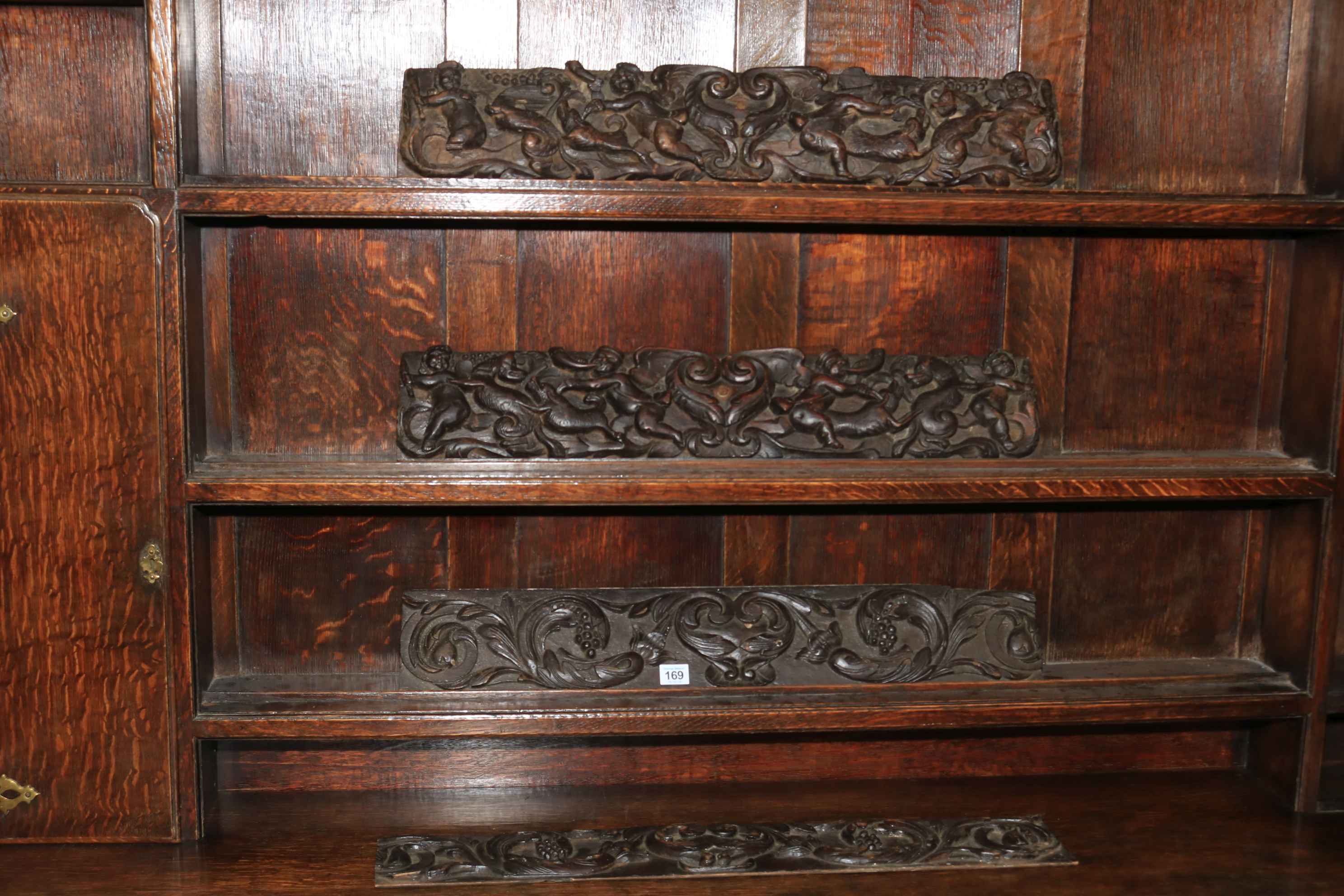 Four vintage wood carving panels.