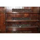 Four vintage wood carving panels.