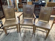 Set of three gold oak ecclesiastical panel back chairs (one arm and two single).