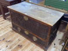 Antique carved oak kist with base drawer, 58.5cm by 96cm by 47cm.