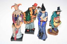 Four Royal Doulton figures, The Mask Seller, Carpet Seller, The Jester and The Wizard.