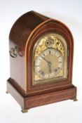 Edwardian mahogany inlaid mantel clock with ornate gilt and silvered dial, 33cm high.