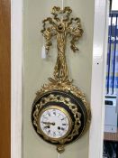 Gilt metal and ebonised cartel clock.