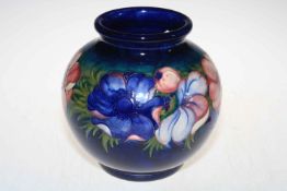 Moorcroft ovoid vase decorated with anemone on blue ground, 22cm high.