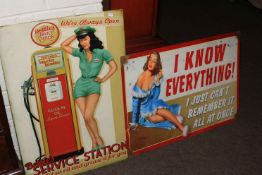 Two advert signs, 'Betties Service Station' and 'I Know Everything'.