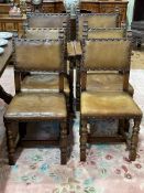 Set of six carved oak and studded leather dining chairs including pair carvers.