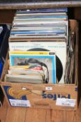 Box of LP records and singles.