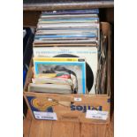 Box of LP records and singles.