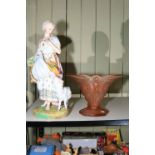 Large bisque figure of a shepherdess and an Art Nouveau peach glass vase.